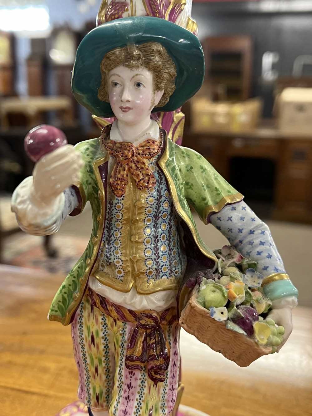 Pair of continental porcelain Minton style candlesticks modelled as fruit and flower sellers, 24cm - Image 13 of 13