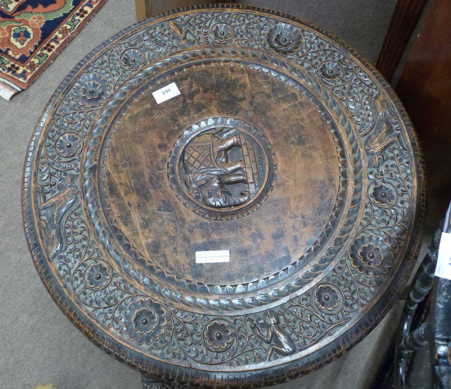 An Indian hardwood occasional table with circular carved top supported on elephant shaped legs, - Image 2 of 3