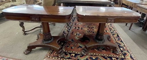 Pair of Regency mahogany and rosewood cross banded card tables of D shaped form with baize lined