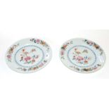 Two 18th Century Chinese porcelain famille rose plates, 23cm diameter, (one with crack and chip)