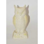 A Belique porcelain model of an owl with brown mark to base