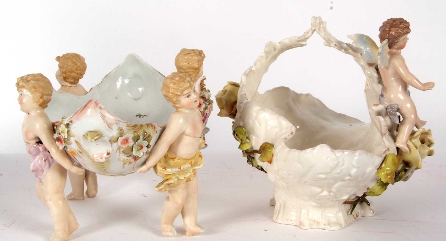 Two continental porcelain baskets one Sitzendorf with applied flowers and cherubs together with a - Image 5 of 11