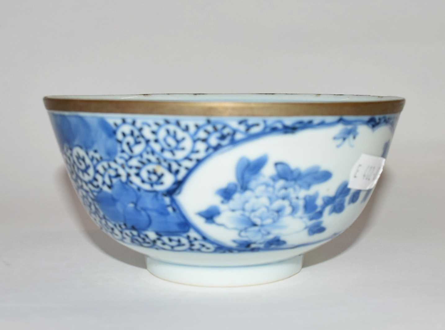 A Chinese porcelain bowl, 19th Century with blue and white floral design, four character mark to