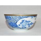 A Chinese porcelain bowl, 19th Century with blue and white floral design, four character mark to