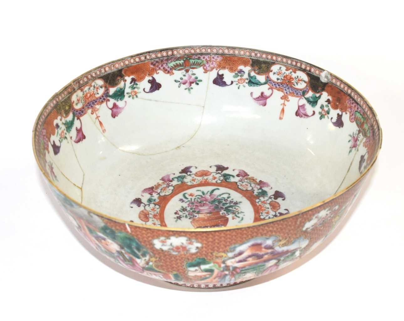 A large Chinese porcelain punch bowl, 18th Century, decorated with Chinese figures (a/f). 27cm