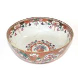 A large Chinese porcelain punch bowl, 18th Century, decorated with Chinese figures (a/f). 27cm