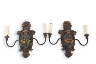 A pair of early 20th Century wall lights with central polychrome panel decorated with a Chinese