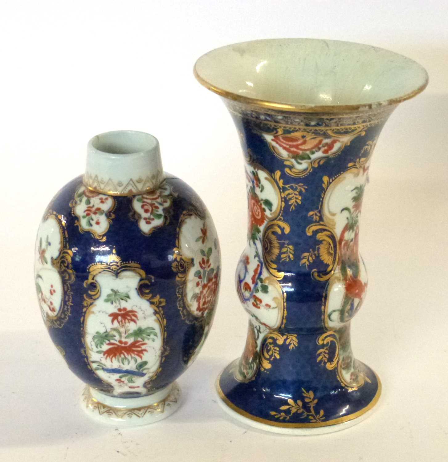 An 18th Century Worcester blue ground beaker vase with Kakiemon style decoration, 15cm high (