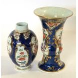An 18th Century Worcester blue ground beaker vase with Kakiemon style decoration, 15cm high (