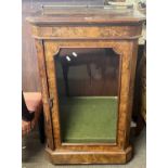 A Victorian walnut veneered pier cabinet with inlaid decoration and glazed door