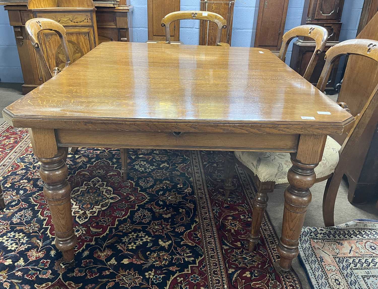 A late Victorian oak extending dining table with crank handle and two additional extension leaves, - Image 6 of 13