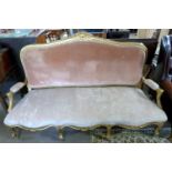 19th Century gilt wood framed sofa with arched back, open arms and serpentine front, upholstered