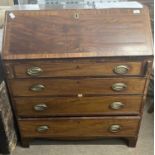 A late Georgian mahogany bureau of typical form with full front, fitted interior and four