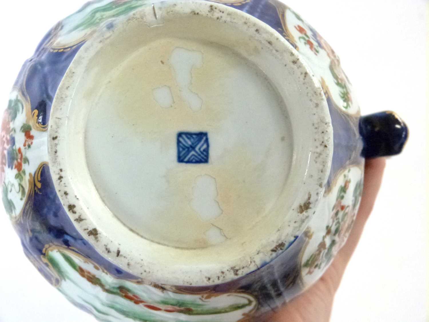 An 18th Century Worcester mask jug with blue ground with panels of Kakiemon style decoration (broken - Image 6 of 6