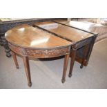 An Adams style mahogany sectional dining table formed of two ends, a central drop leaf section and a