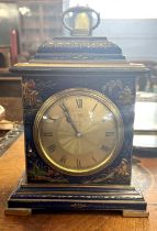 A small early 20th Century chinoiserie decorated mantel clock fitted with a brass French movement,
