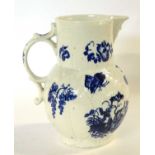 A Worcester porcelain mask jug decorated with prints of the parrot pecking fruit, 17cm high (