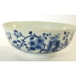 An early Worcester porcelain punch bowl with the prunus fence decoration and workmans mark to