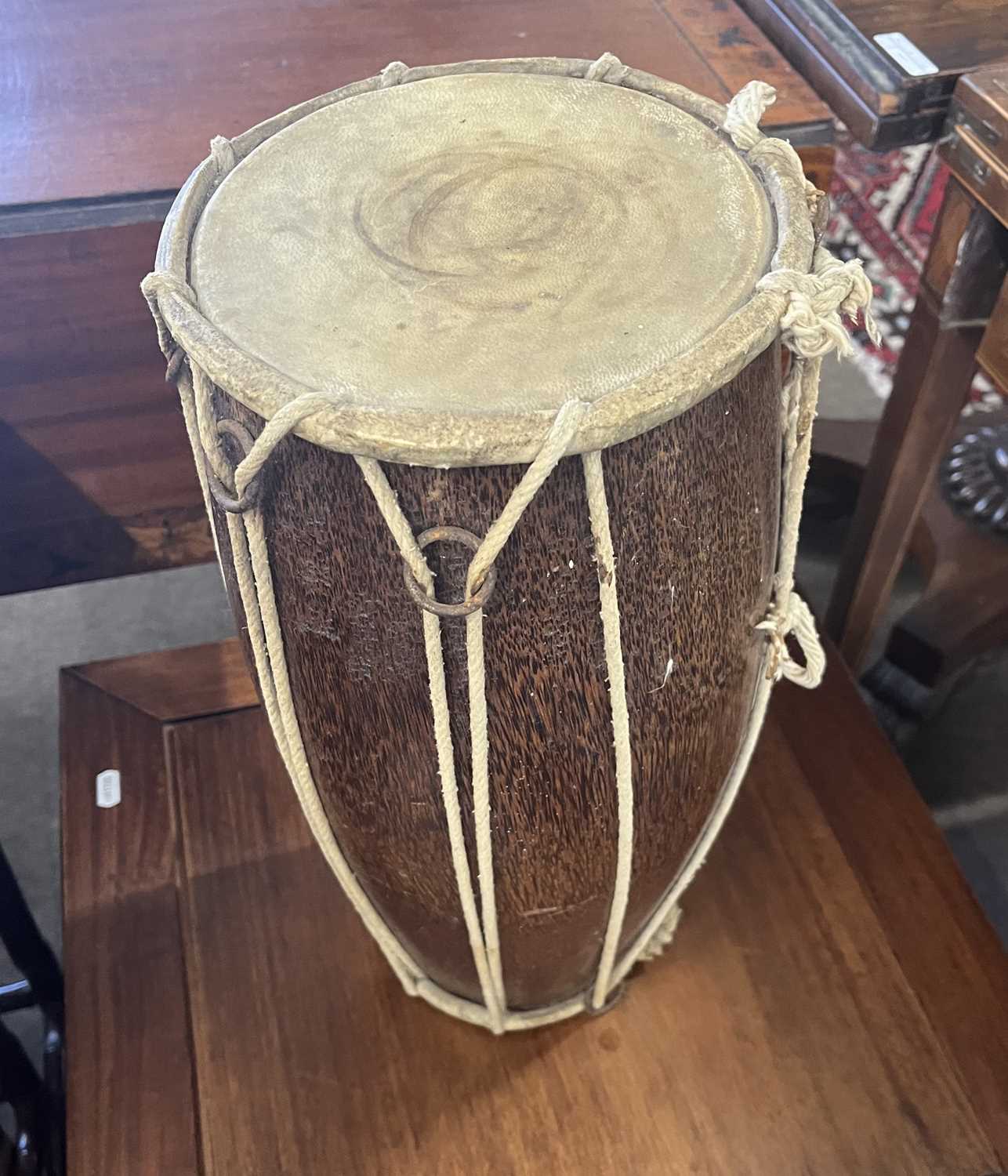 A small hide covered hardwood double ended drum, 25cm high - Image 2 of 3