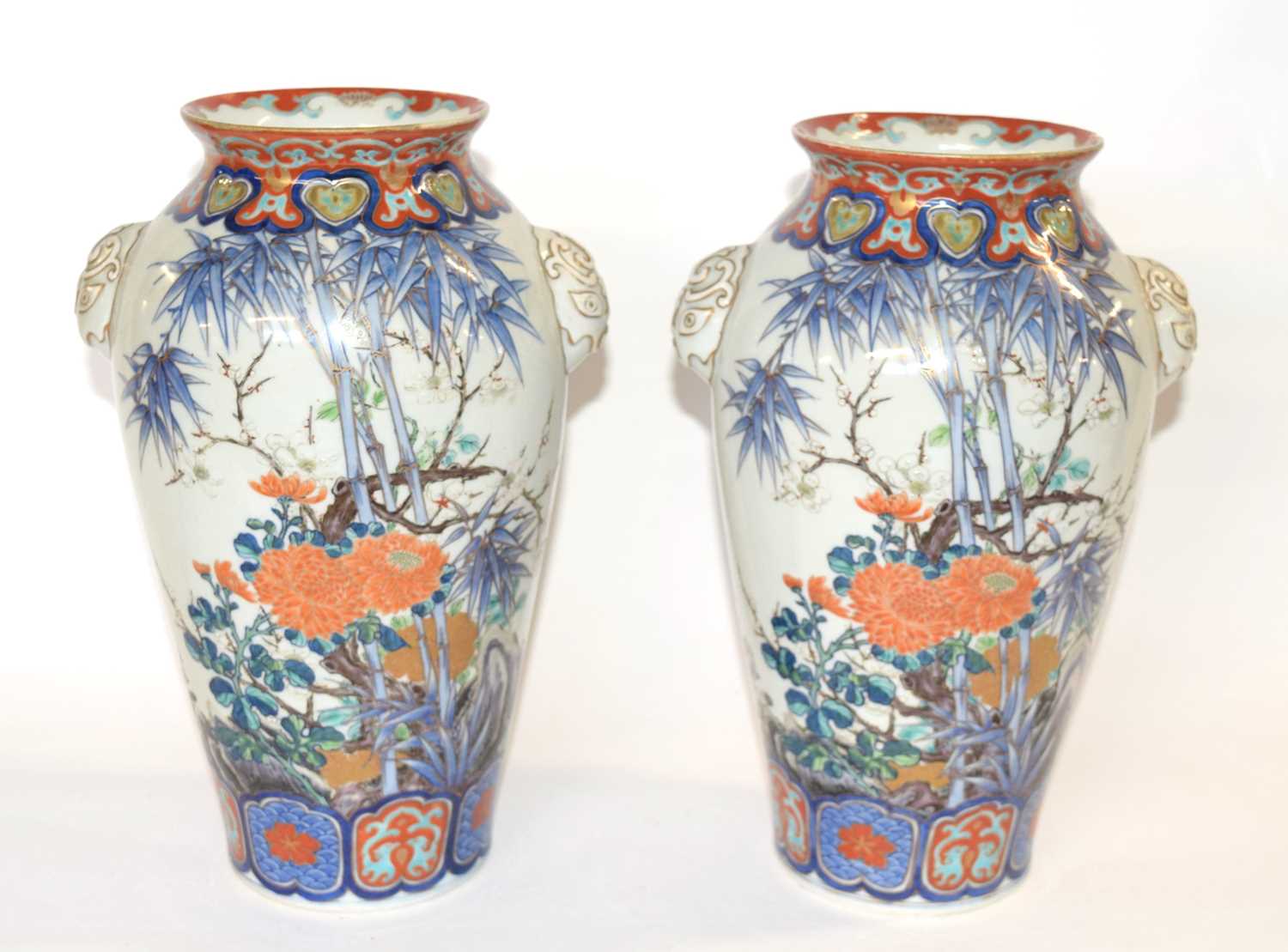 A pair of Japanese porcelain vases Meiji period with polychrome decoration of flowers and birds (