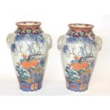 A pair of Japanese porcelain vases Meiji period with polychrome decoration of flowers and birds (