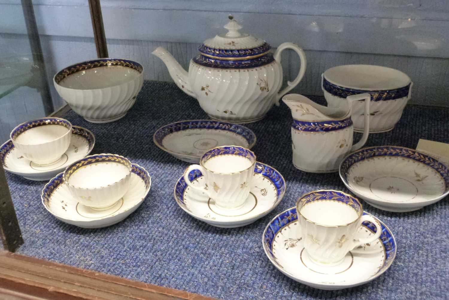 A late 18th Century Worcester part tea set or possibly Caughley comprising teapot, milk jug,