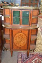 An ornate 19th Century satinwood side cabinet of D shaped form fitted with a pierced brass