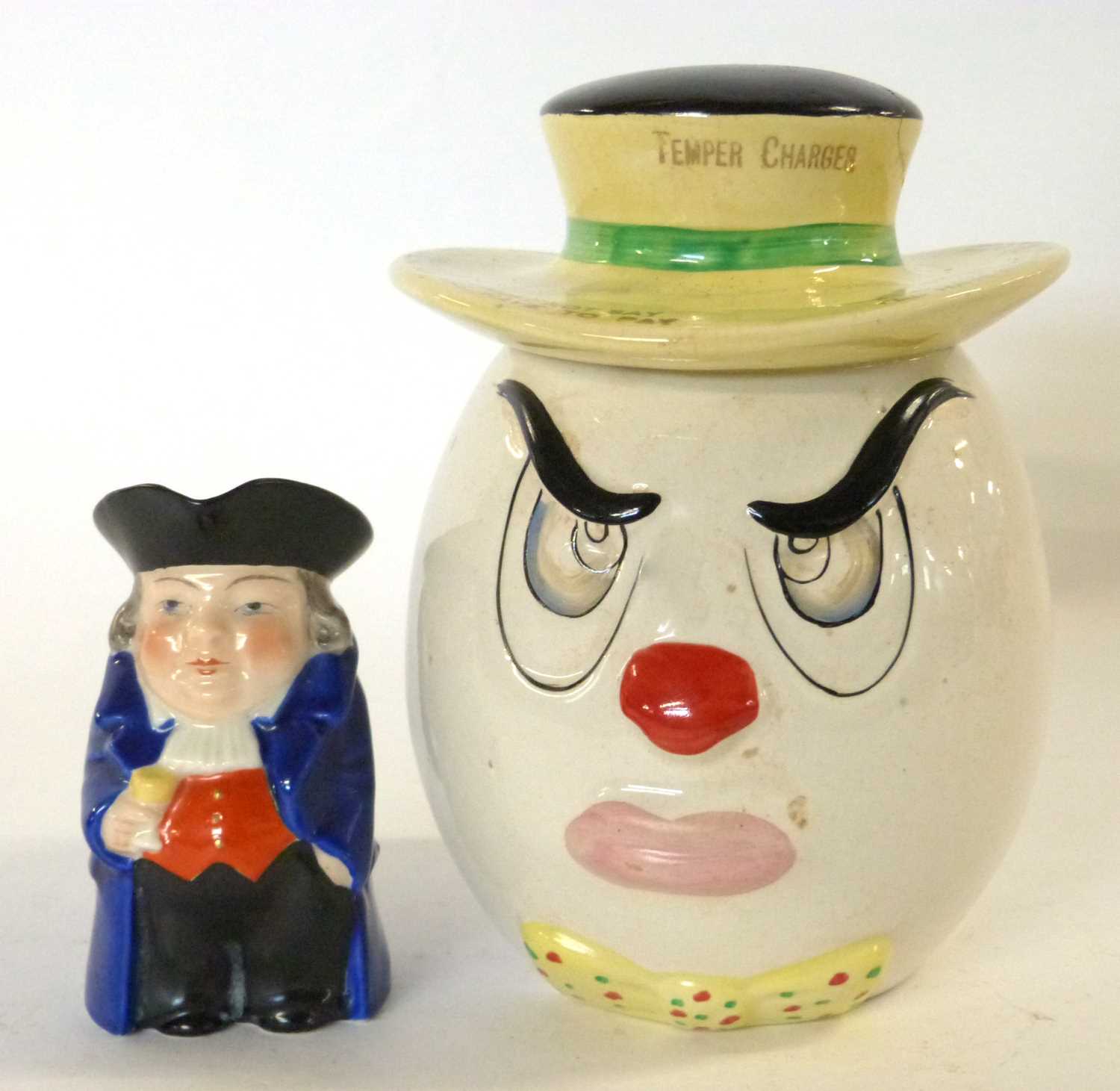A ceramic square money box together with a small Royal Worcester Toby jug
