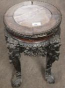 Small Chinese hardwood and marble top four footed plant stand, top 28cm diam (a/f)