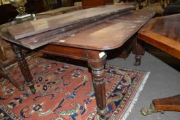A large Georgian mahogany extending dining table for restoration, 117cm wide, the leaves adding a