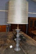 Pewter two branch table lamp of circular form, 82cm high ( Converted Chinese Alter candlestick)
