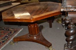 An unusual 19th Century octagonal centre table with inlaid armorial to centre, surrounded by