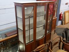 Edwardian mahogany display cabinet with bowed centre, shelved interior and body decorated with