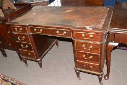 Late 19th century mahogany twin pedestal writing desk in the Empire style with leather inset top