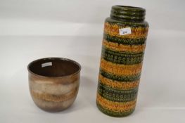 Two examples of West German pottery including a tall vase with ribbed design and a jardiniere, the