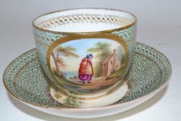 An early 19th Century English porcelain cup and saucer with painted decoration of children in