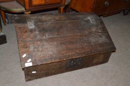 Early 18th century oak desk box of wedge shaped form with hinged lid and four small interior