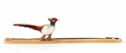 A 15ct pheasant bar brooch, the pheasant modelled with a split pearl body and enamelled plummage,