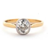 An 18ct single stone diamond ring, the oval old mine cut diamond, estimated approx. 0.90cts, in a