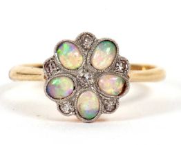 An 18ct and platinum opal and diamond ring, the flowerhead cluster with oval opal cabochon petals