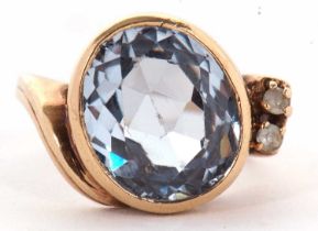 A blue spinel and white stone ring, the oval mixed cut spinel in a rubover mount, set