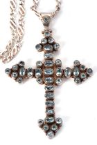 A topaz cross, the cross set with oval and round faceted topaz, all collet mounted with a flat back,