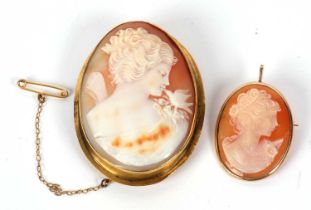 A 9ct mounted cameo and another, the first oval shell cameo with mount stamped 375 and hinged bale