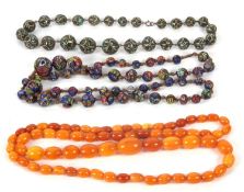 A butterscotch amber bead necklace, the oval beads between approx. 7 - 16mm diameter, 50g,