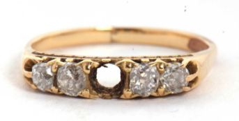 A diamond ring, set with four old mine cut diamonds (centre stone missing), all set in unmarked