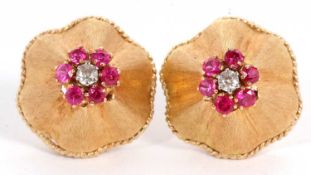 A pair of mid 20th century ruby and diamond earrings, set to centre with a small round diamond