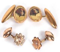 Two pairs of cufflinks, one set with oval discs with an image of a spaniel with linked marquise
