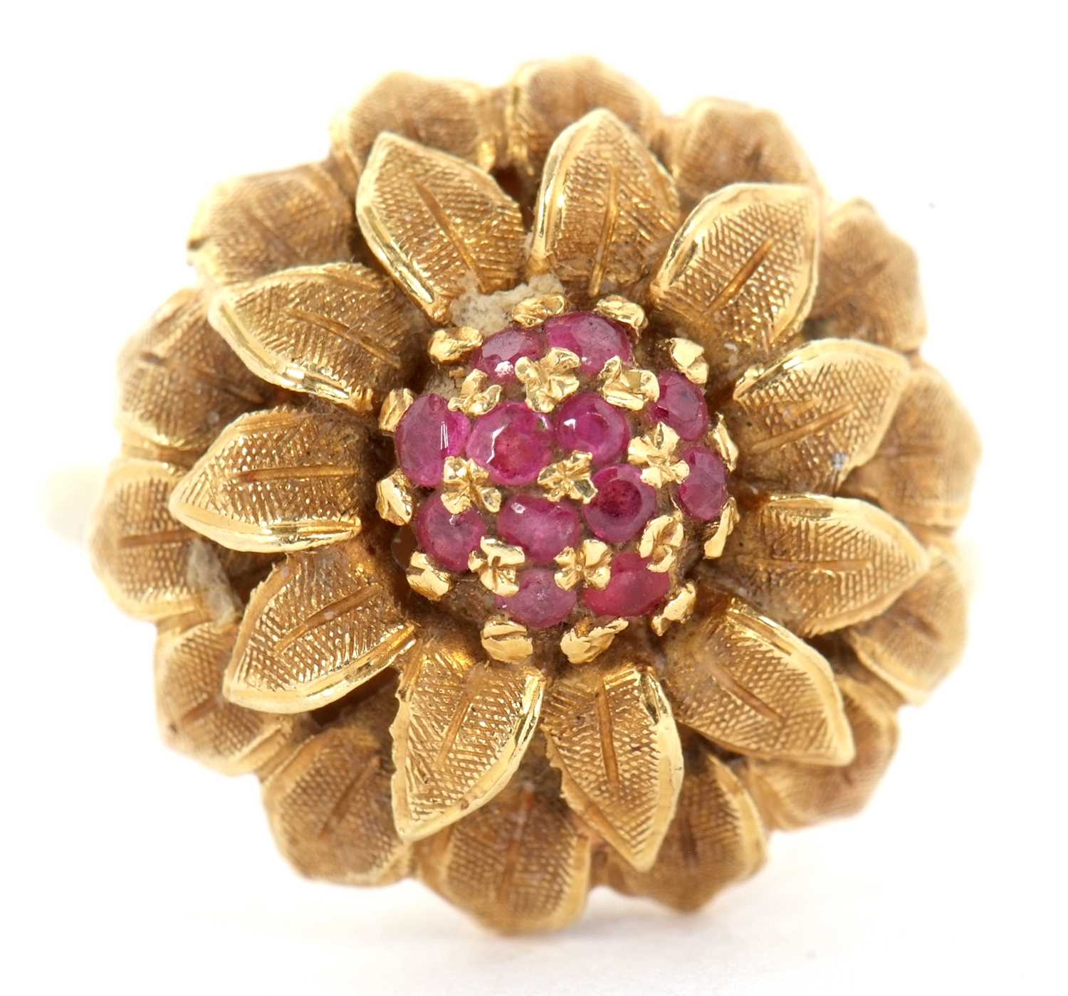 A 1960's 18ct and ruby flower ring, set to centre with small round rubies and surrounded by