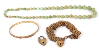 A green hardstone bead necklace with clasp stamped '9c', together with a gilt metal gate bracelet