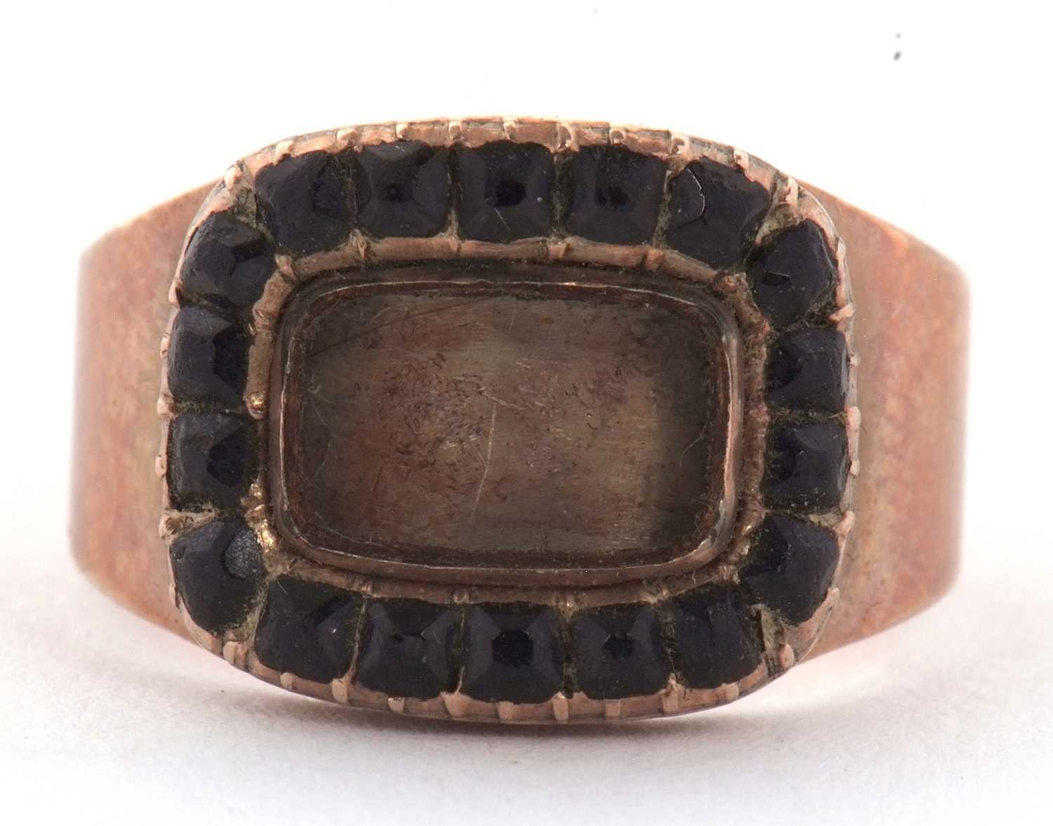 An early 19th century memorial ring, the rectangular keepsake panel (empty) surrounded by black
